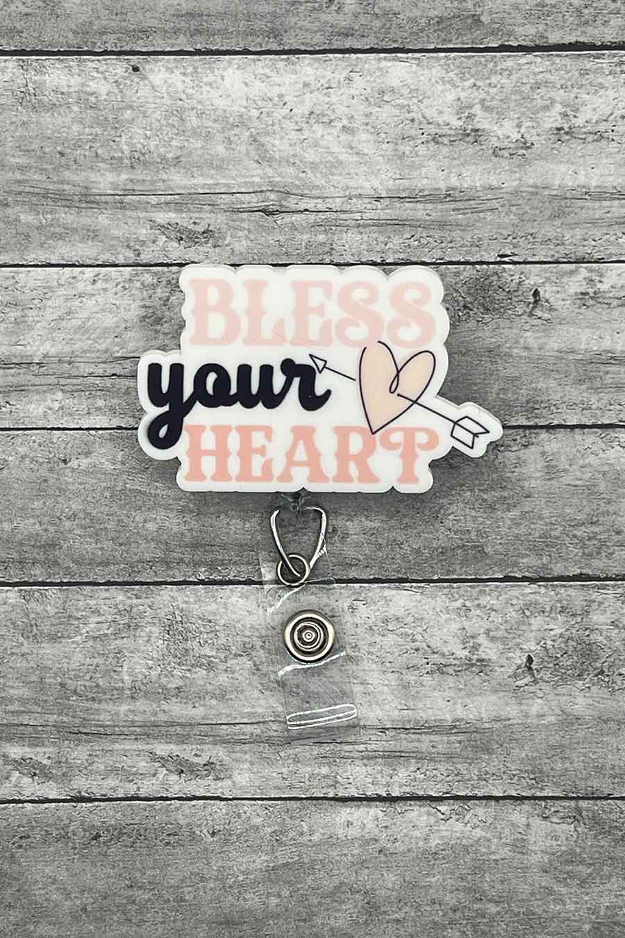 "Bless Your Heart Badge Reel featuring the phrase 'Bless Your Heart' with a heart accent in elegant typography."